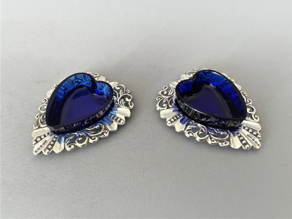 A pair of Edwardian silver & glass heart shaped salt dishes View III