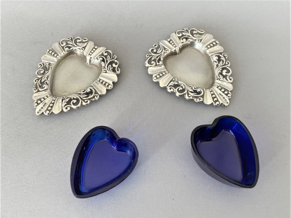 A pair of Edwardian silver & glass heart shaped salt dishes View IV