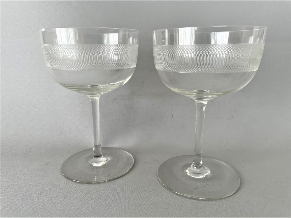 A charming pair of etched Edwardian champagne coupes View II