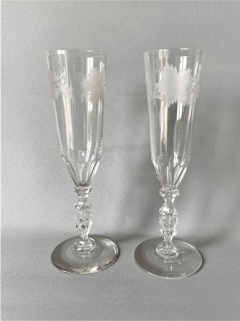 A stunning pair of Victorian cut & etched champagne flutes