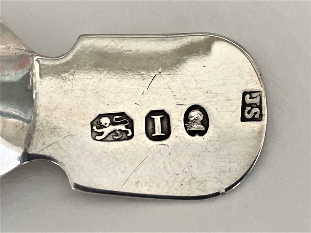 A delightful Georgian silver caddy spoon View III