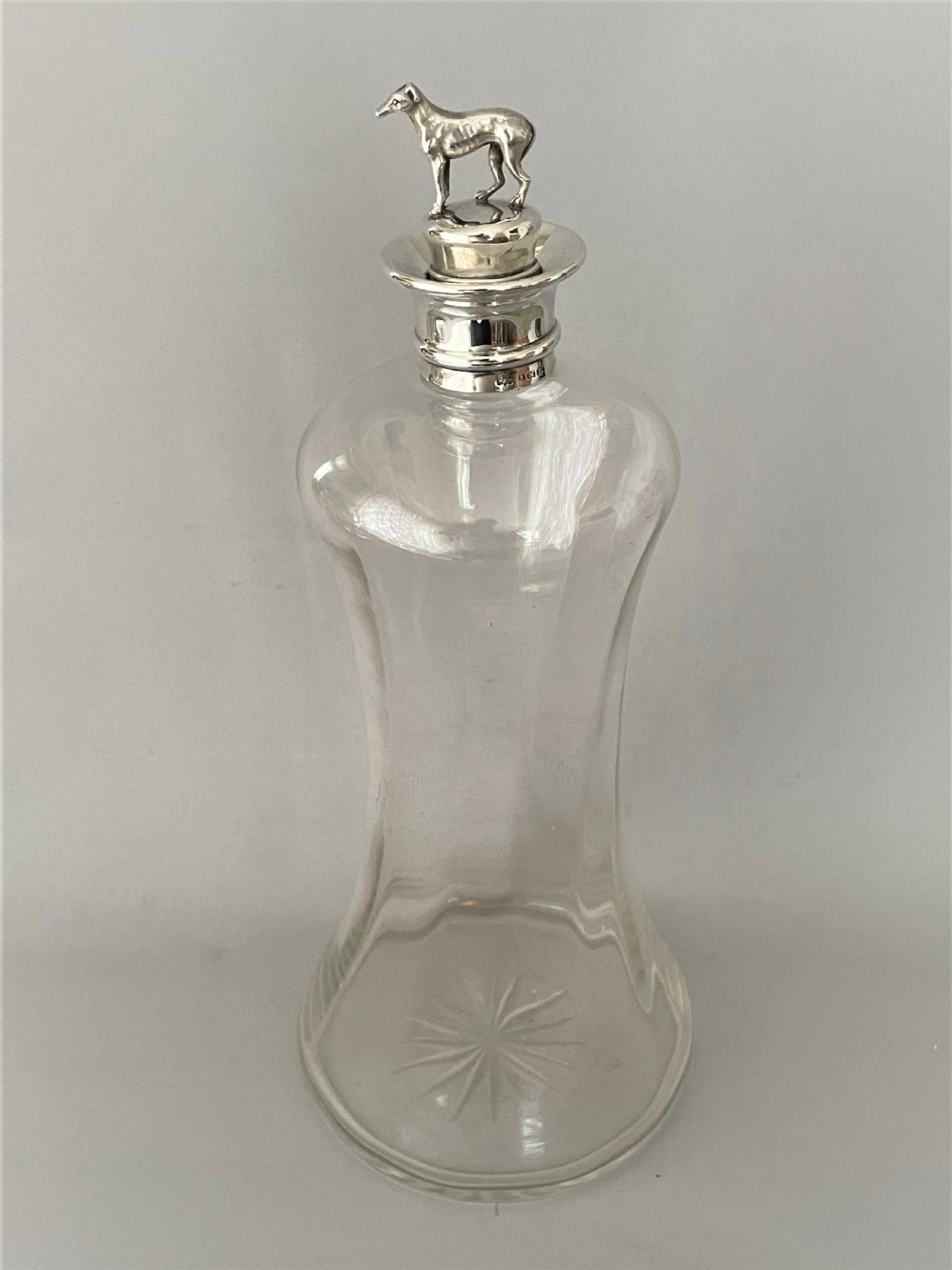 A rare Victorian silver mounted decanter with greyhound stopper View II