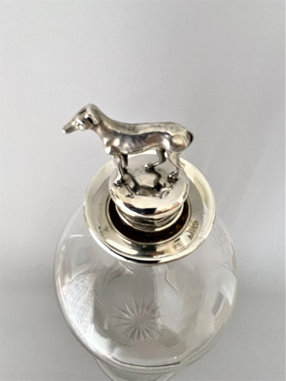 A rare Victorian silver mounted decanter with greyhound stopper View VII
