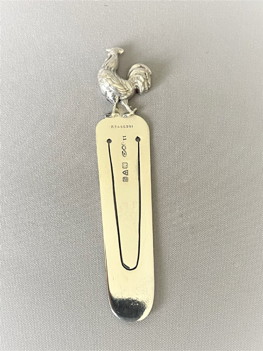 An Edwardian silver rooster bookmark by Sampson Morden