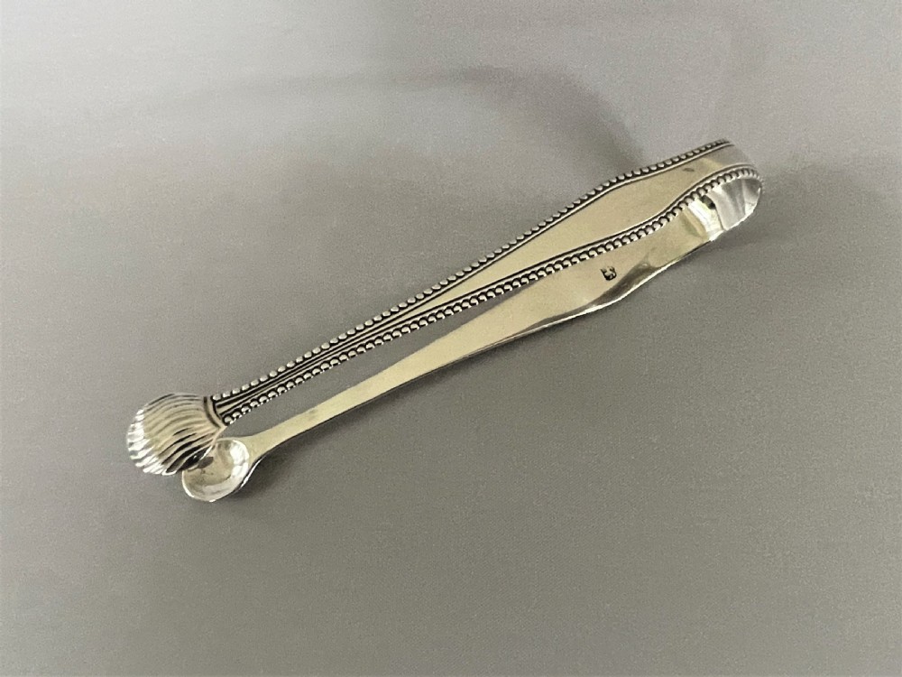 A Susannah Barker pair of 18th Century silver tongs View III