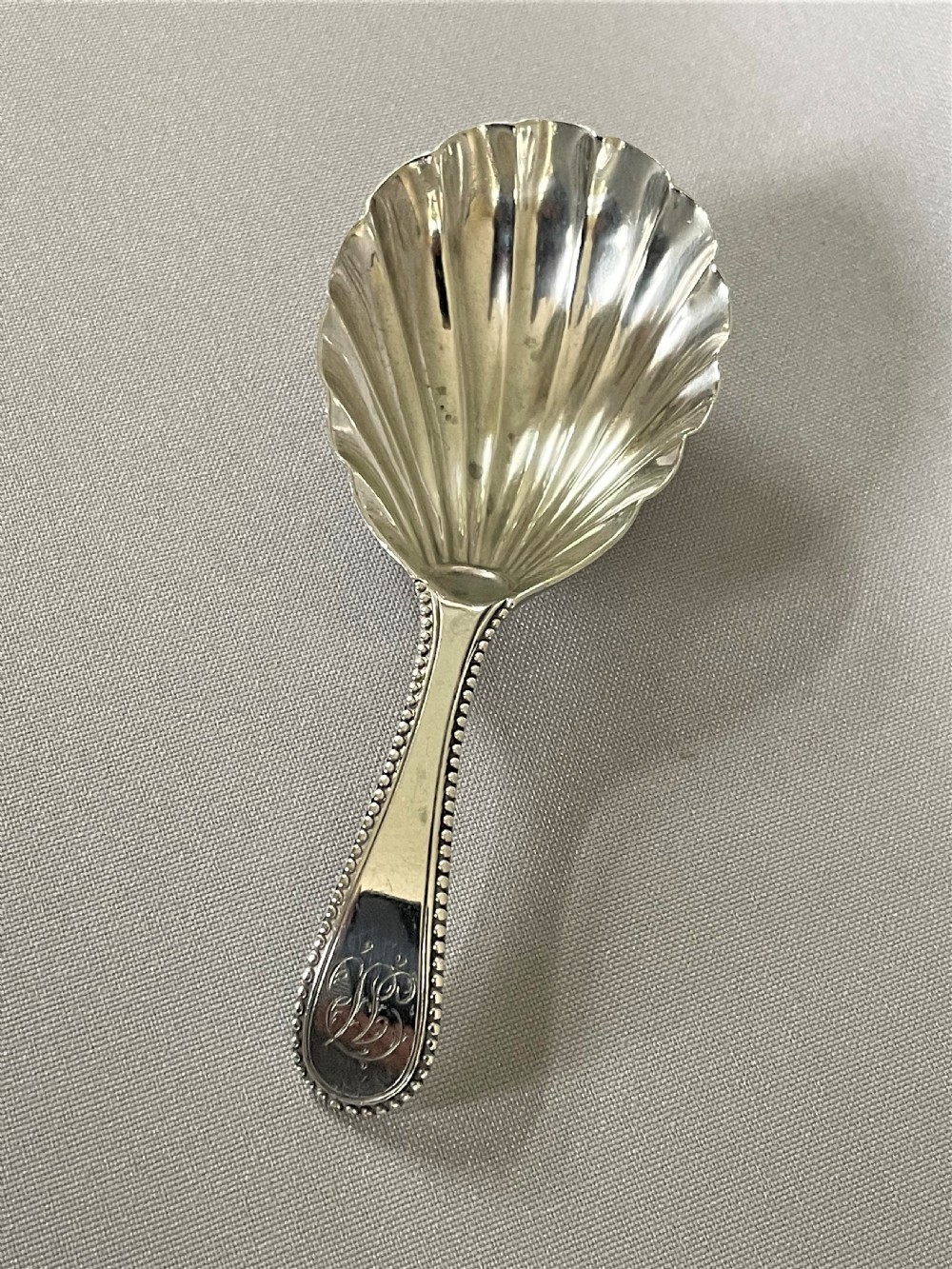 A bead pattern George III silver caddy spoon