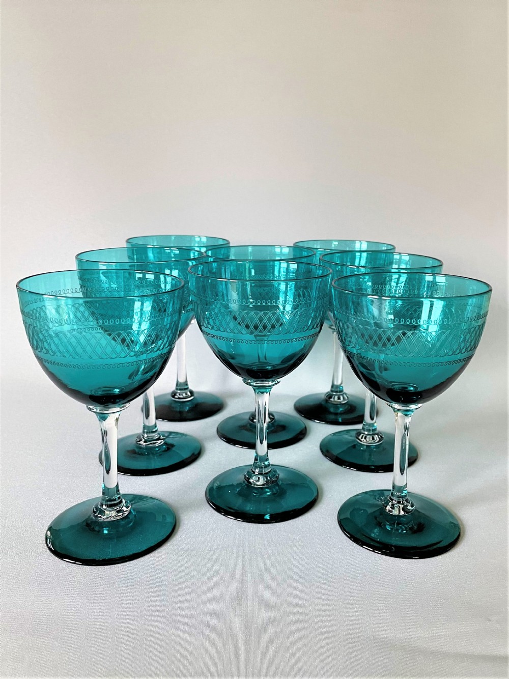 A fabulous set of 8 Victorian pale green wine glasses