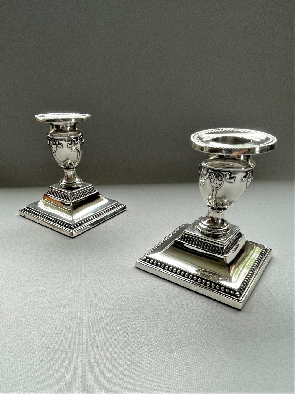 A Charming pair of Edwardian silver dwarf candle sticks
