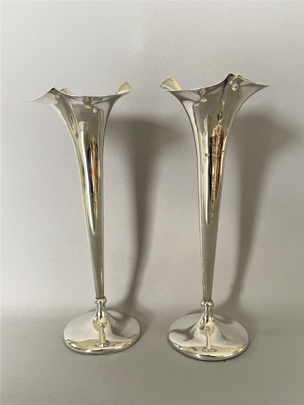 A lovely pair of Edwardian silver stem vases