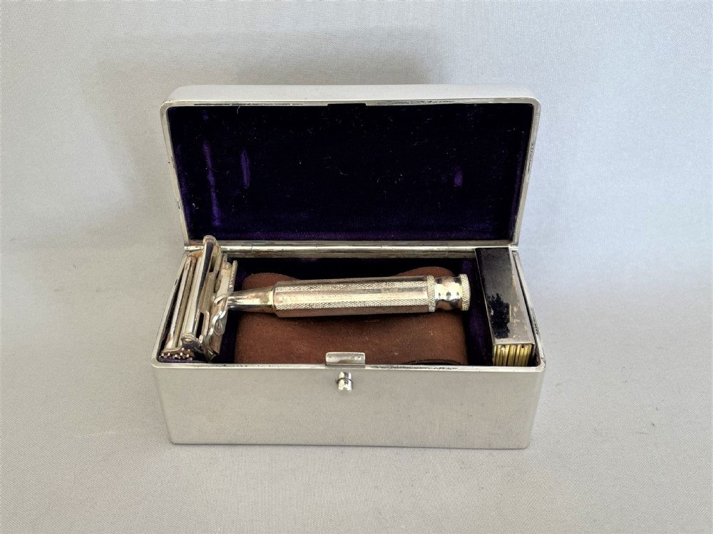 An outstanding Sampson Morden silver cased travelling razor set