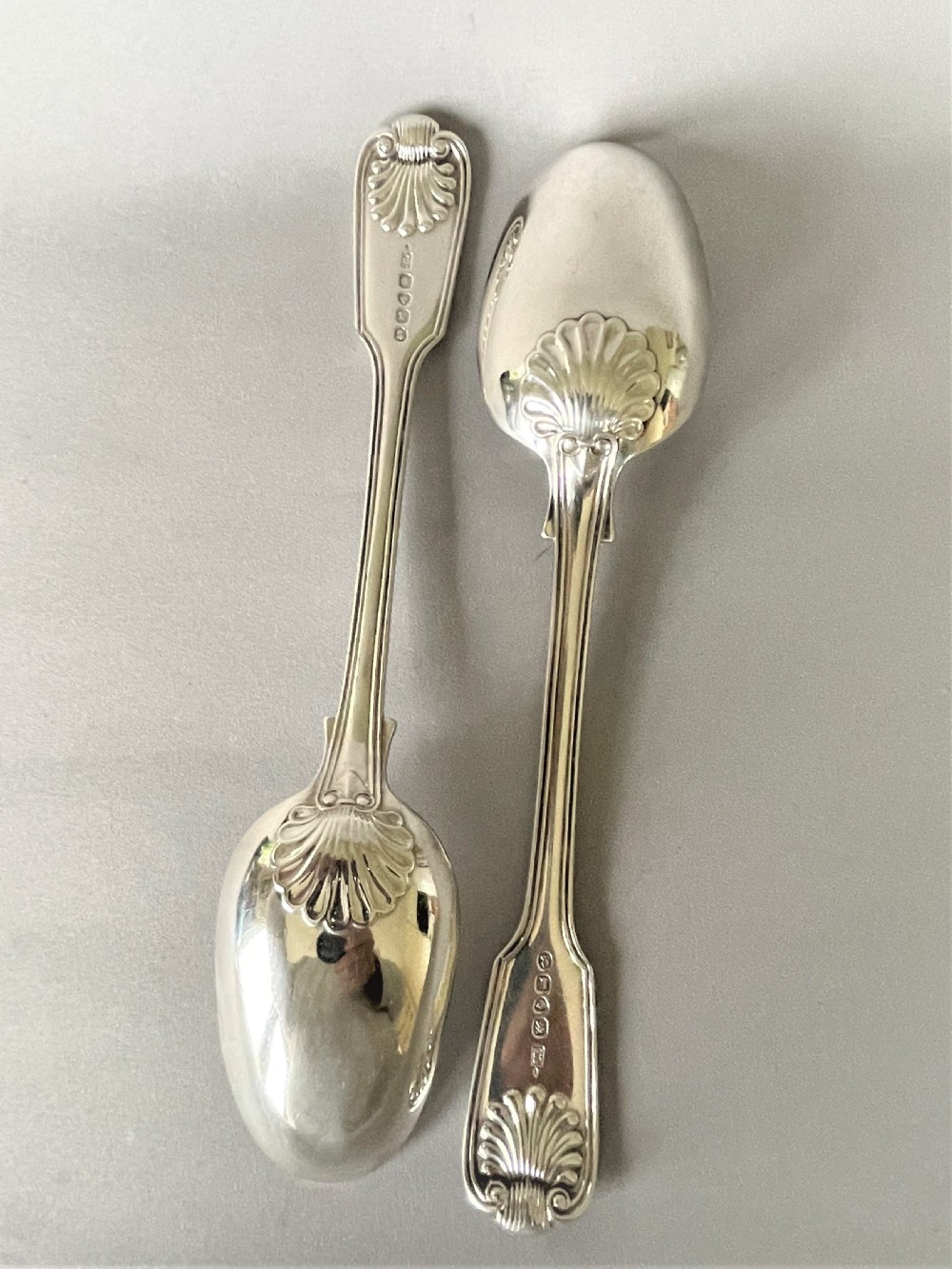A handsome pair of Georgian silver fiddle, thread & shell table spoons View IV
