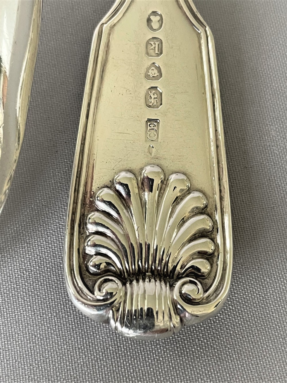 A handsome pair of Georgian silver fiddle, thread & shell table spoons View VII