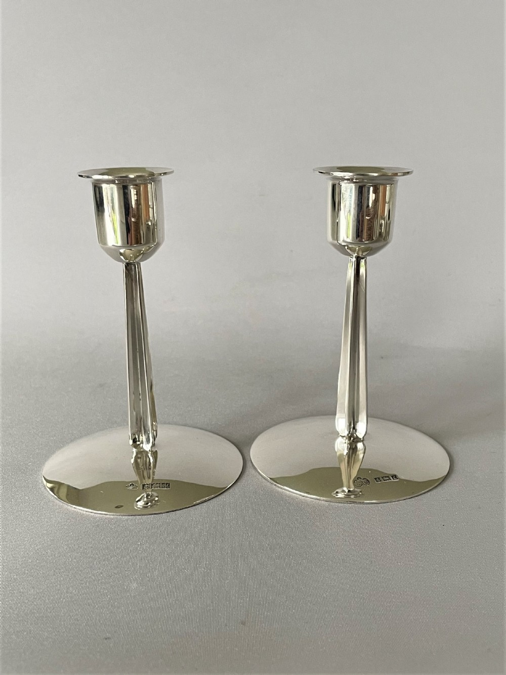 A stylish pair of third height silver candlesticks View IV