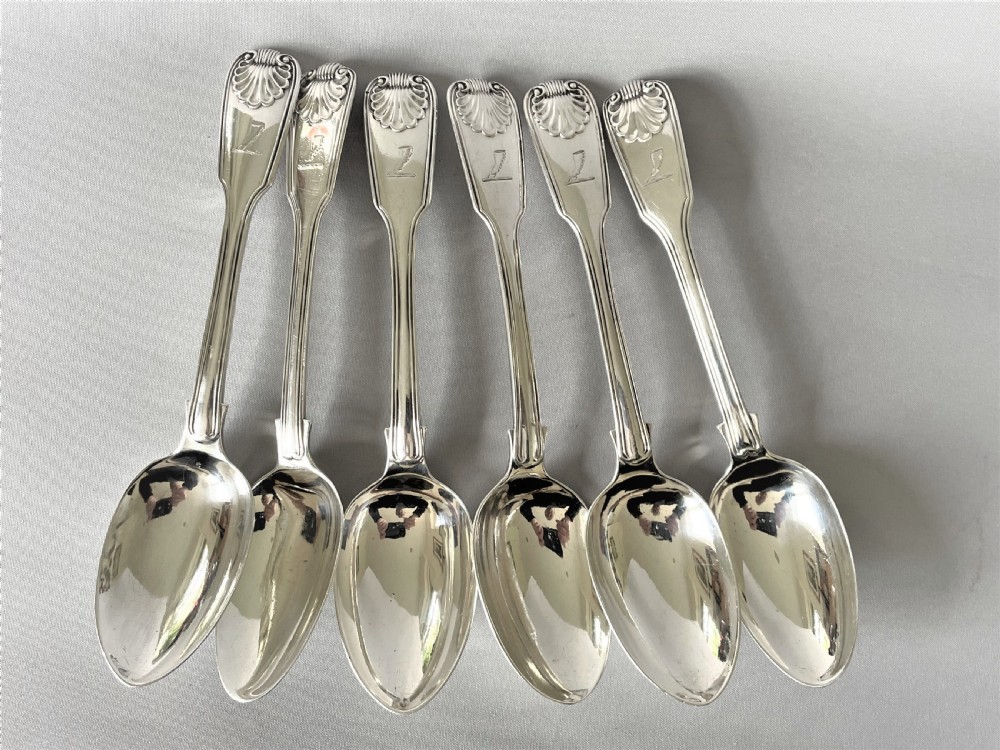 A superb matched set of silver Fiddle, thread & shell dessert spoons View II