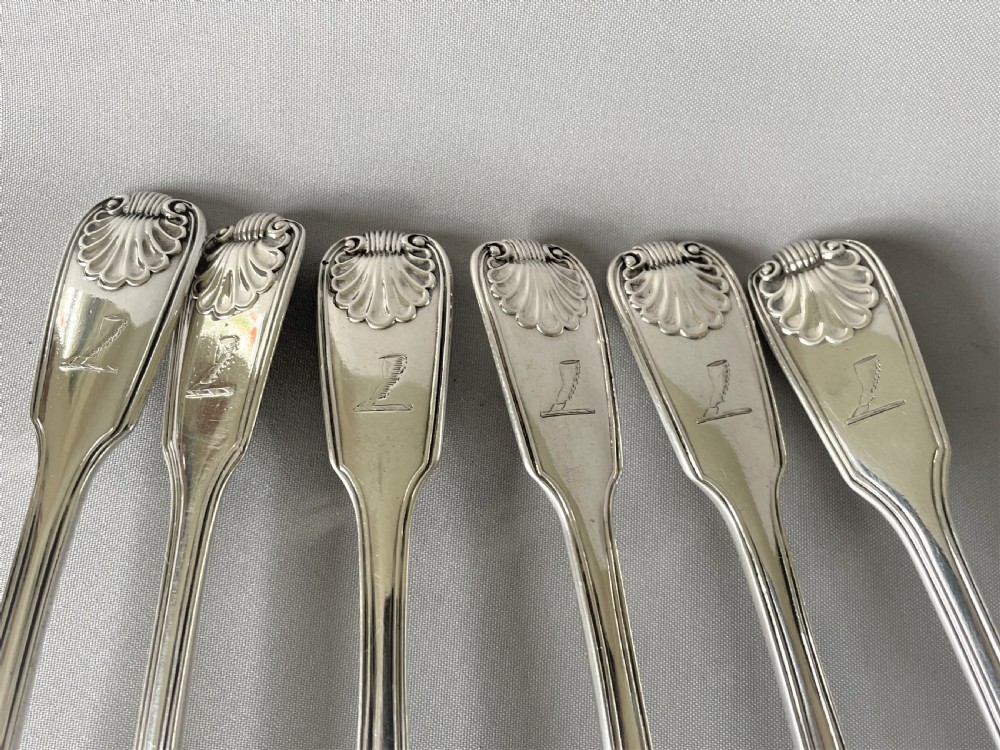 A superb matched set of silver Fiddle, thread & shell dessert spoons View III