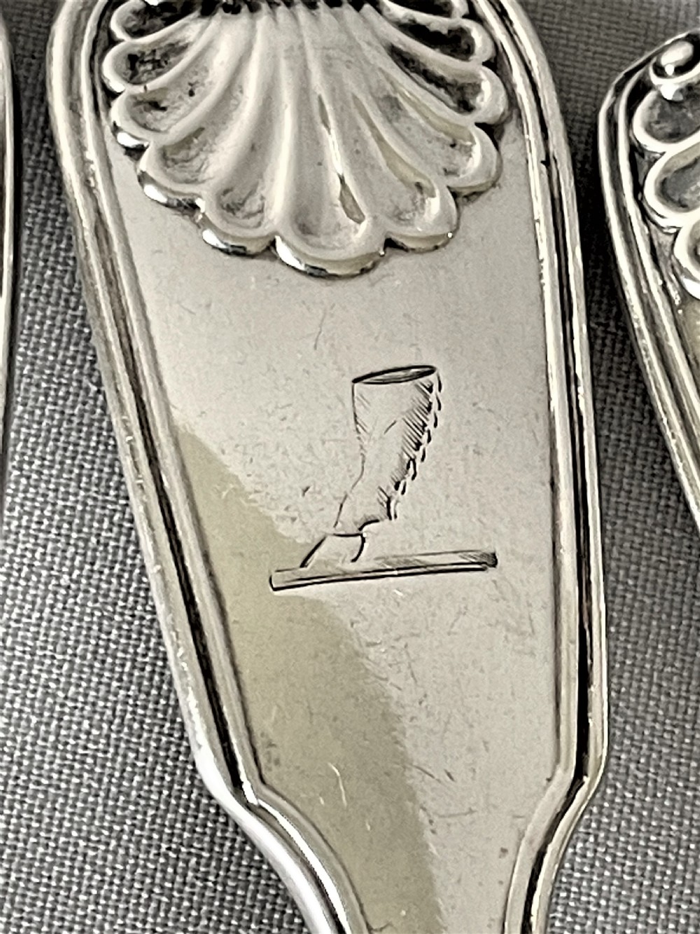 A superb matched set of silver Fiddle, thread & shell dessert spoons View IV