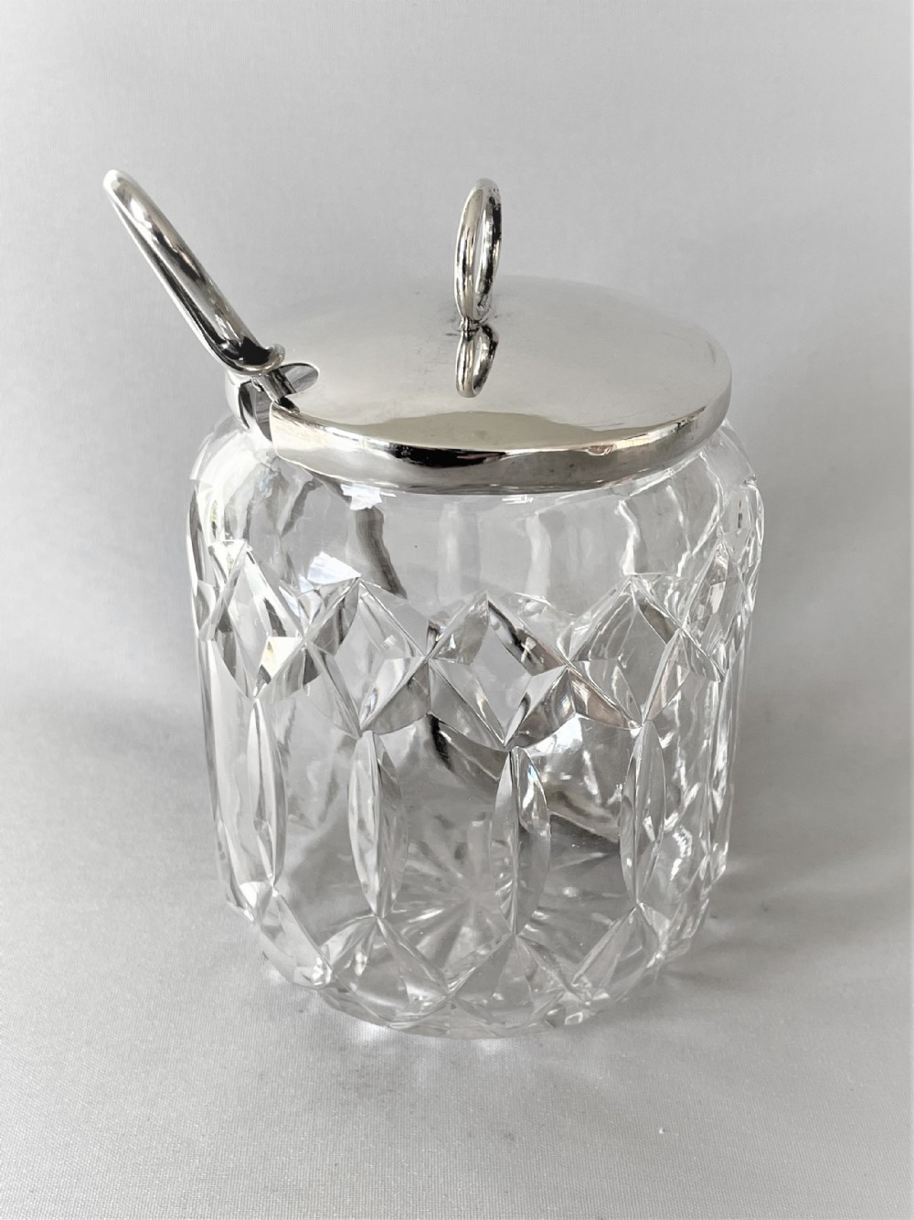 A fine George V silver mounted preserve jar & spoon