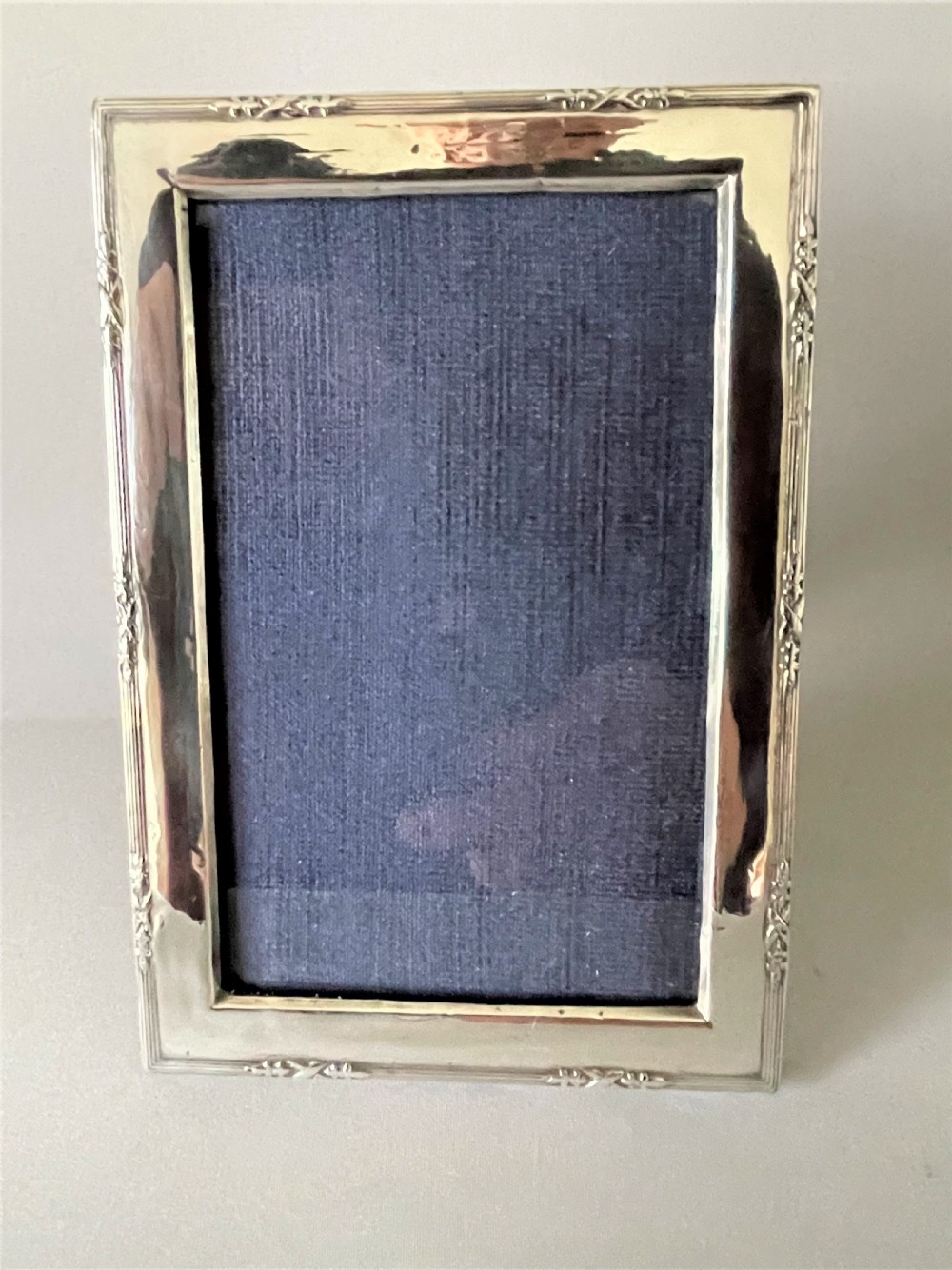 A charming small silver landscape/portrait photo frame View IV