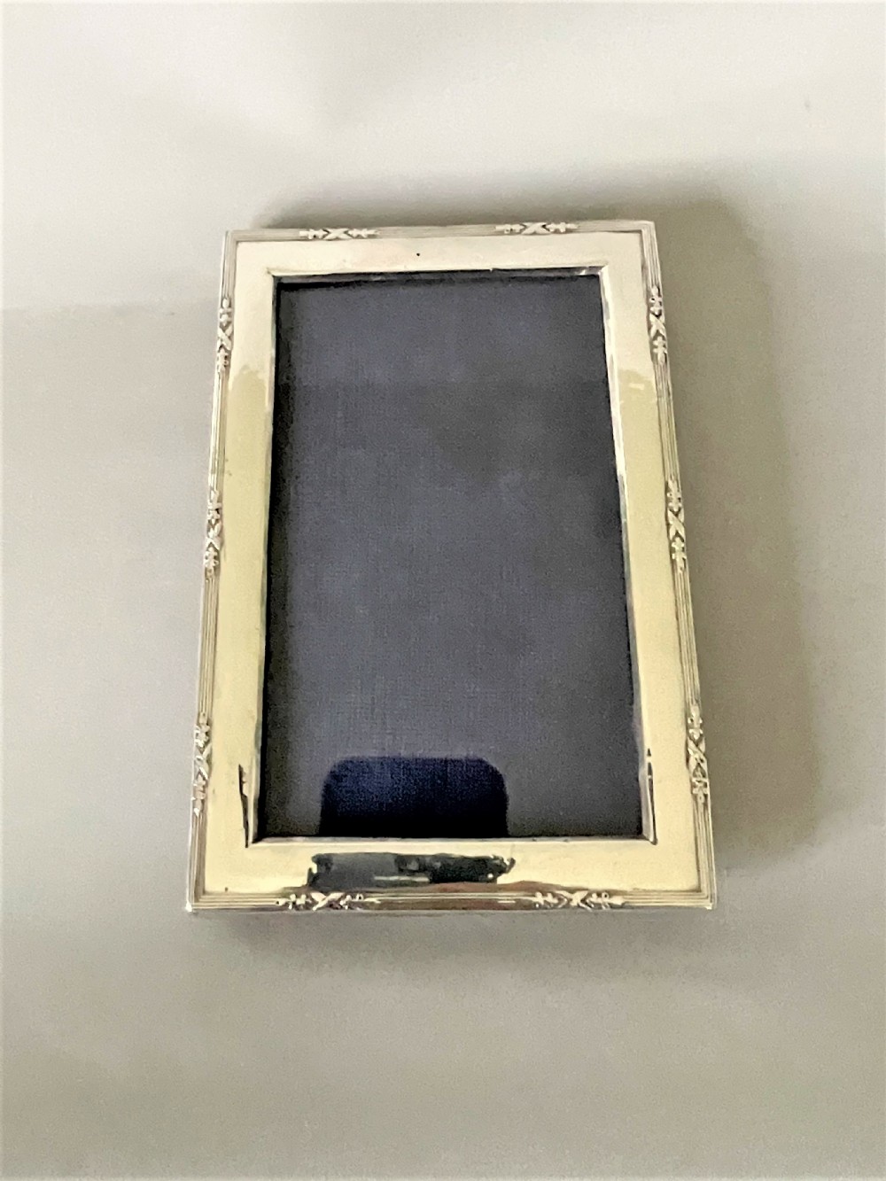 A charming small silver landscape/portrait photo frame View V