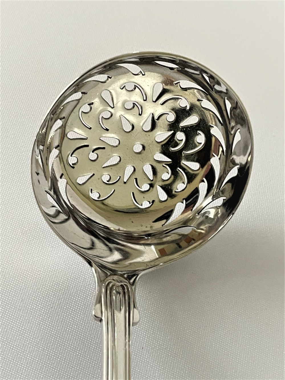 A superb Victorian Fiddle, Thread & Shell silver sifter spoon View II
