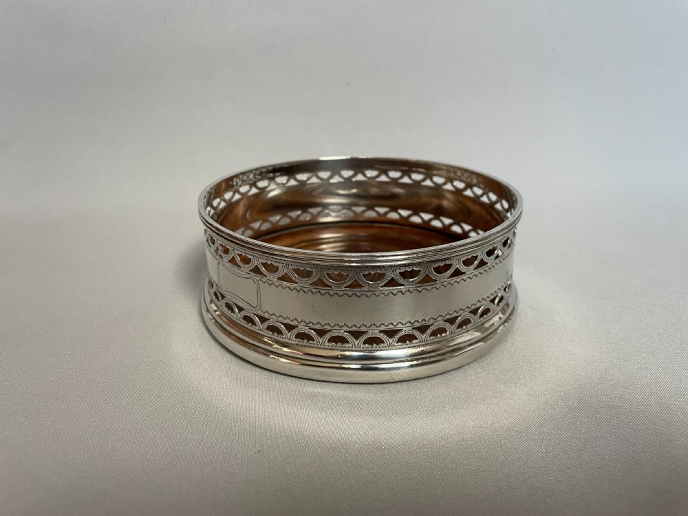 A hallmarked silver wine bottle/decanter coaster View II