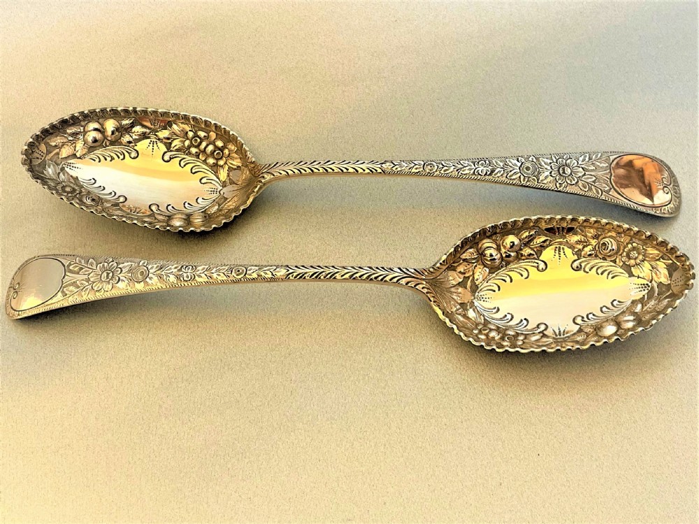 A lovely pair of Victorian silver gilt fruit/dessert serving spoons