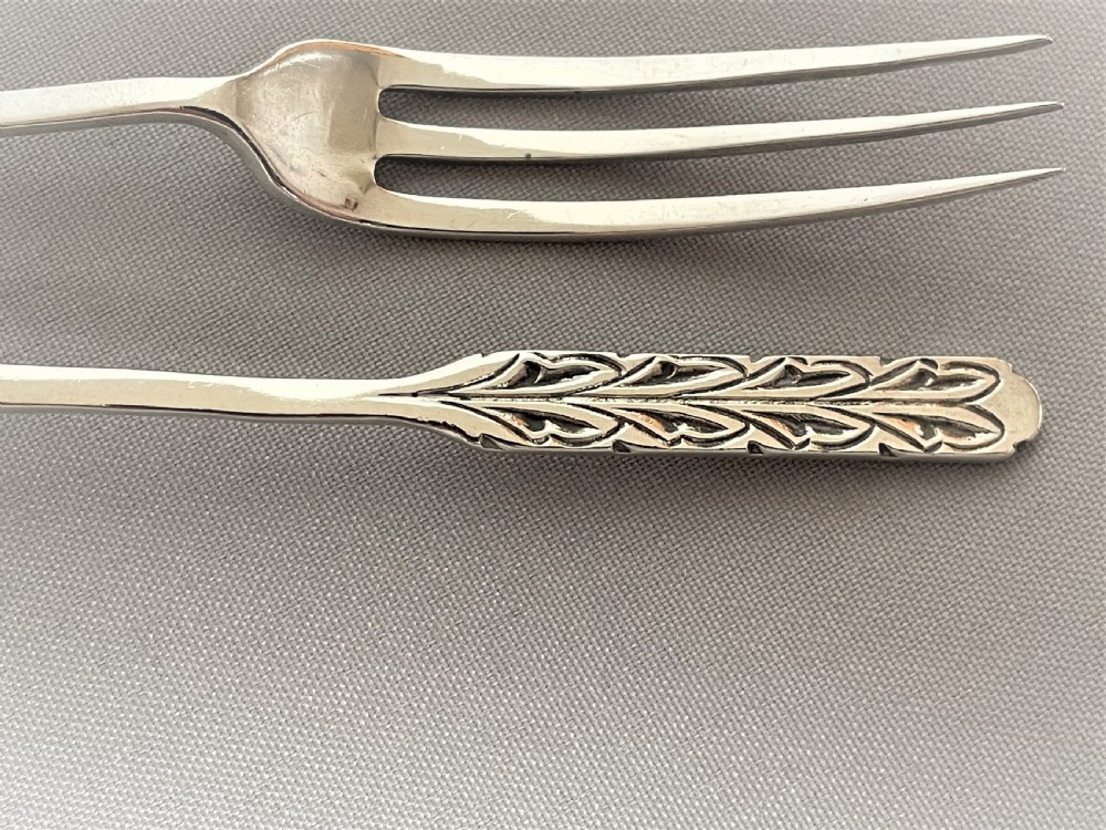 A rare pair of Liberty & Co. silver pickle/sweetmeat forks View II