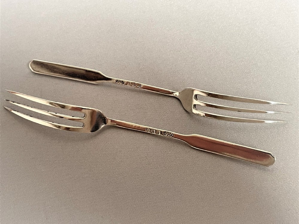 A rare pair of Liberty & Co. silver pickle/sweetmeat forks View III