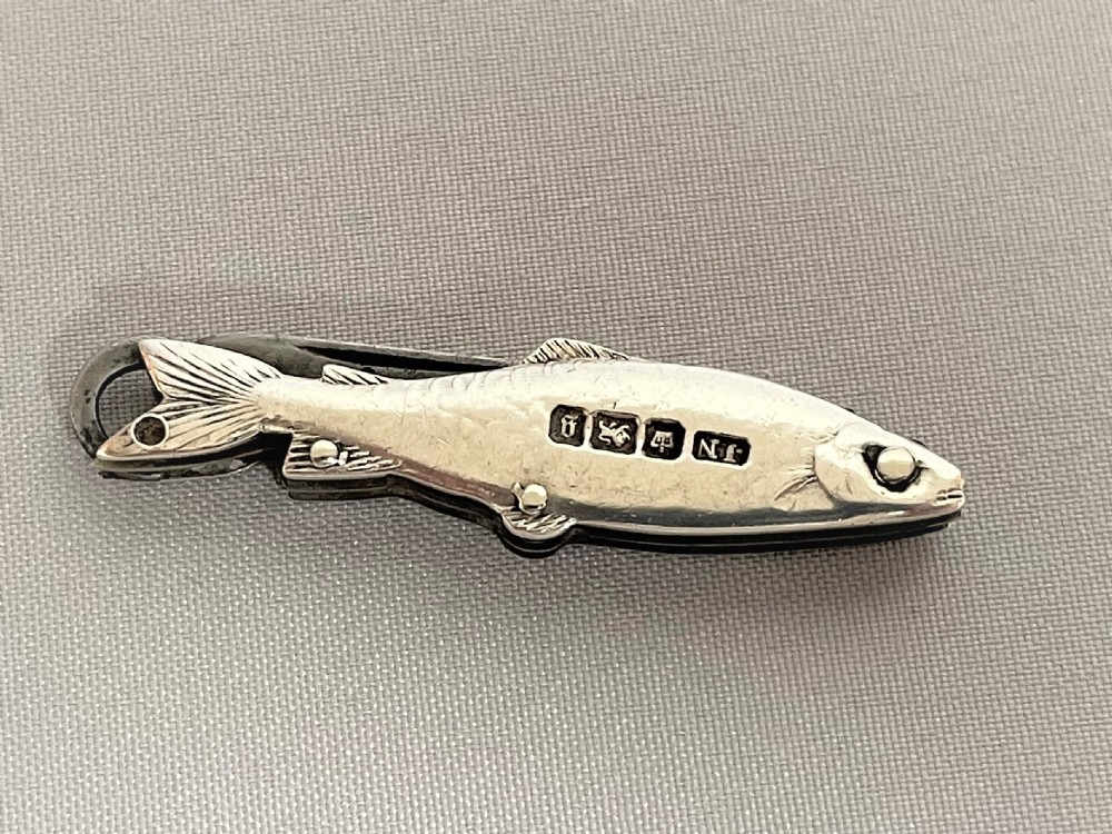 A rare Victorian novelty silver fruit knife/button hook combo