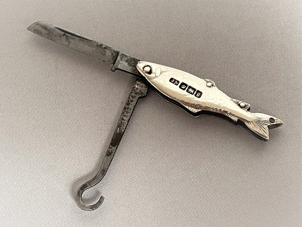 A rare Victorian novelty silver fruit knife/button hook combo View III