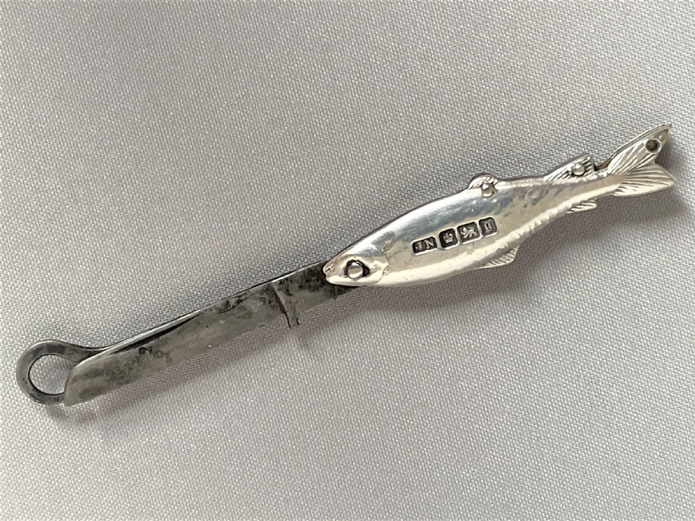 A rare Victorian novelty silver fruit knife/button hook combo View V