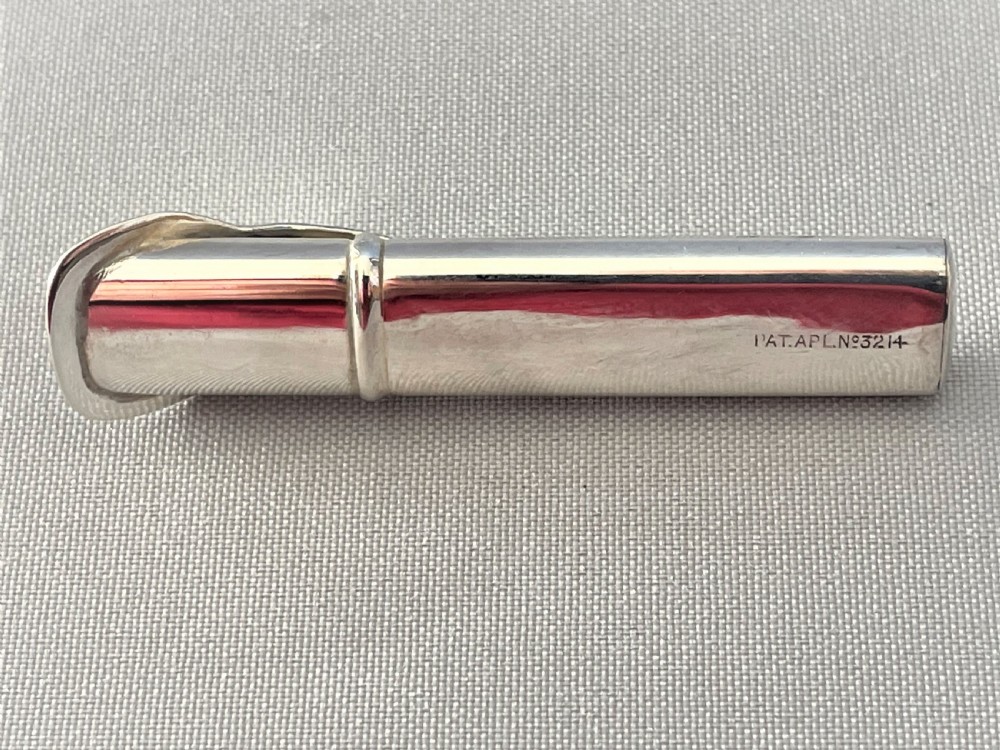 A charming Edwardian silver button hole holder View III