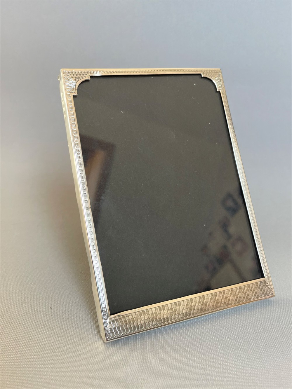 A small Art Deco silver photo frame