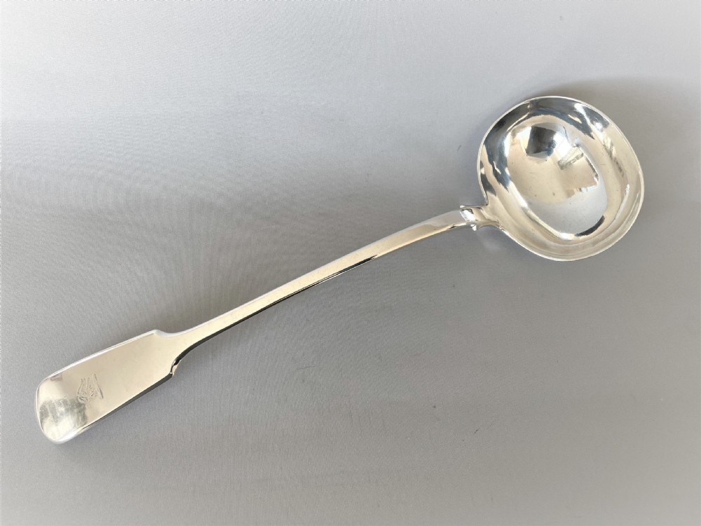 A substantial Victorian silver soup ladle