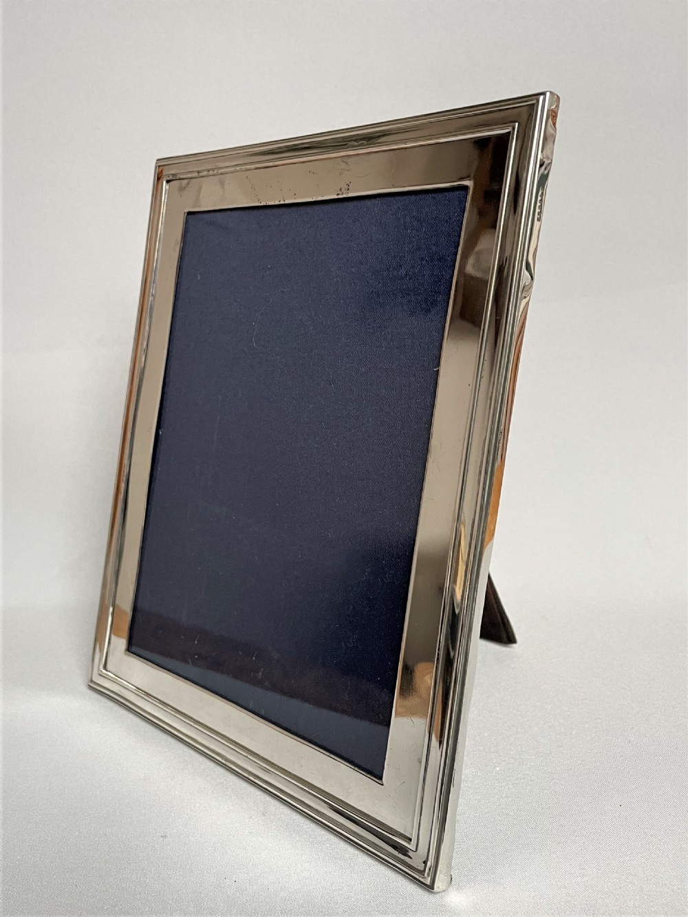 A large silver photo frame with unusual silver mount View II