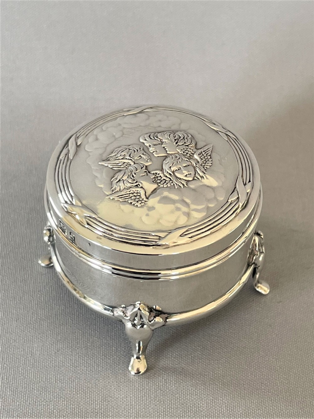 An Edwardian 'Reynolds Angels' small silver ring/trinket box View II