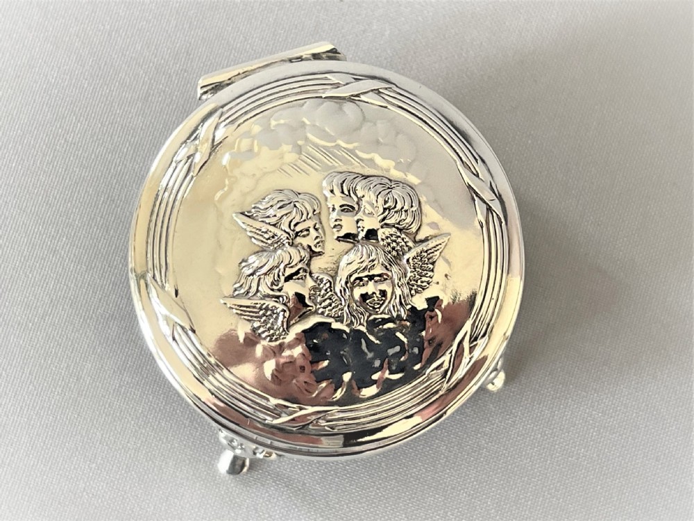 An Edwardian 'Reynolds Angels' small silver ring/trinket box View III