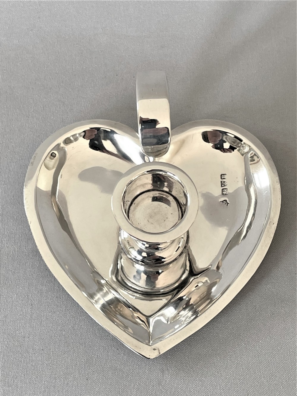 A lovely Chester silver heart shaped chamber stick View II