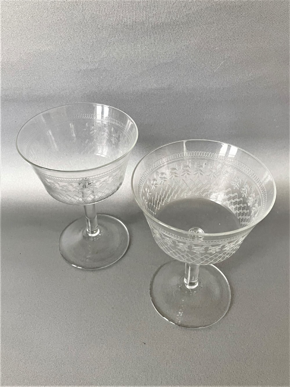 An elegant pair of Edwardian etched champagne coupes View II