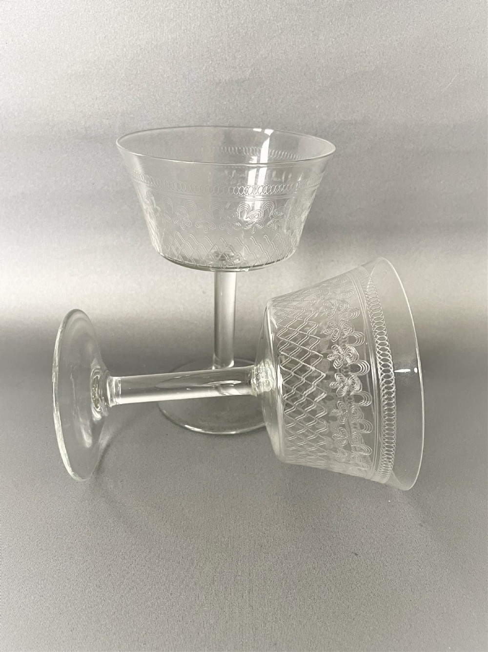 An elegant pair of Edwardian etched champagne coupes View III