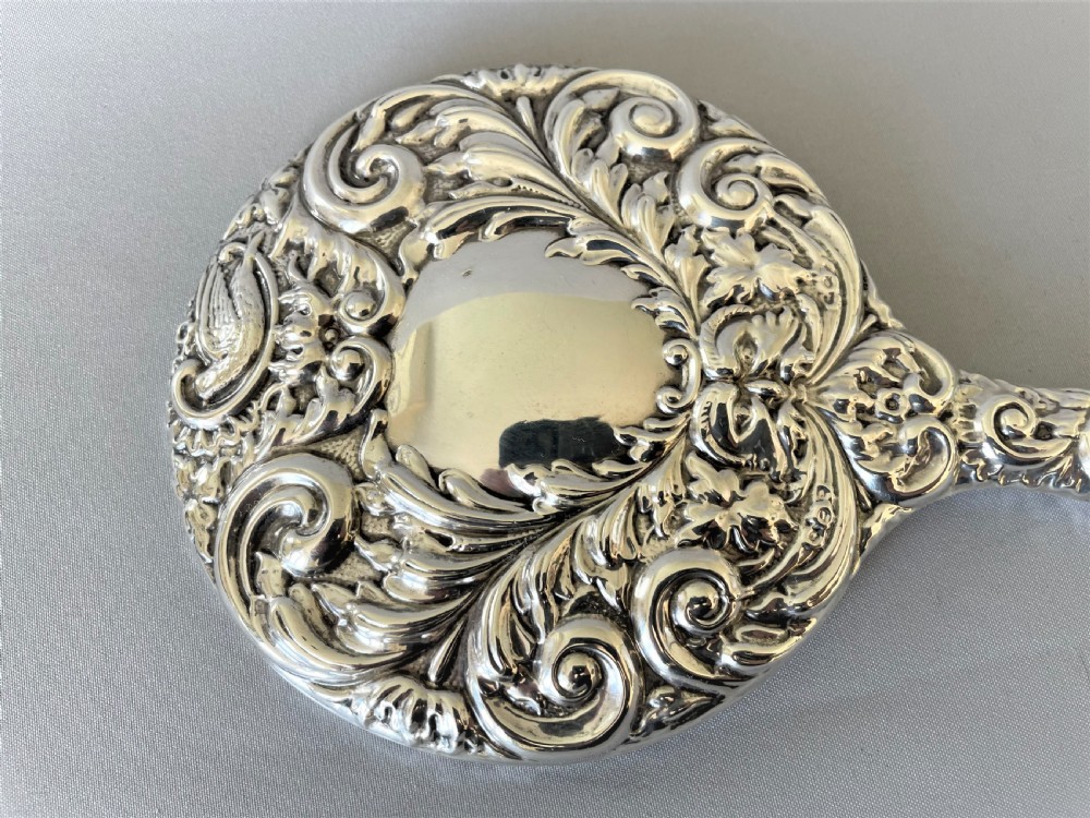 A gorgeous vintage silver hand mirror View III