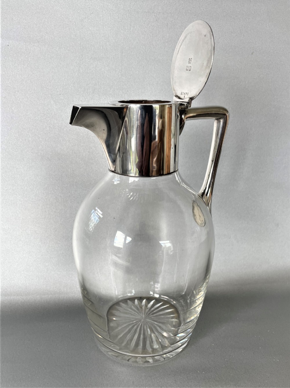 A Hukin & Heath stylish silver mounted claret jug View III