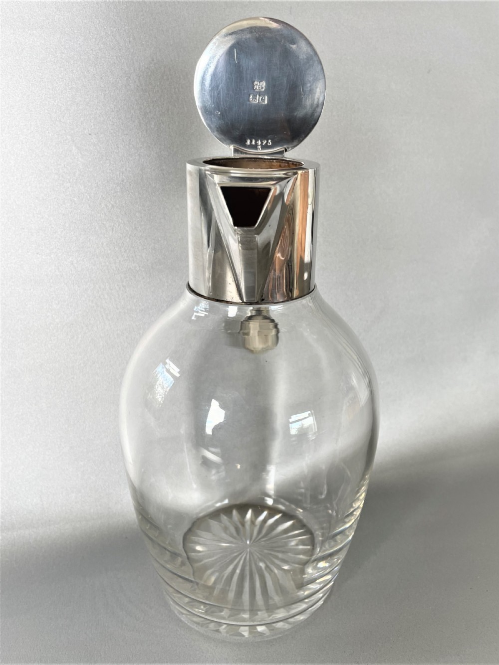 A Hukin & Heath stylish silver mounted claret jug View V