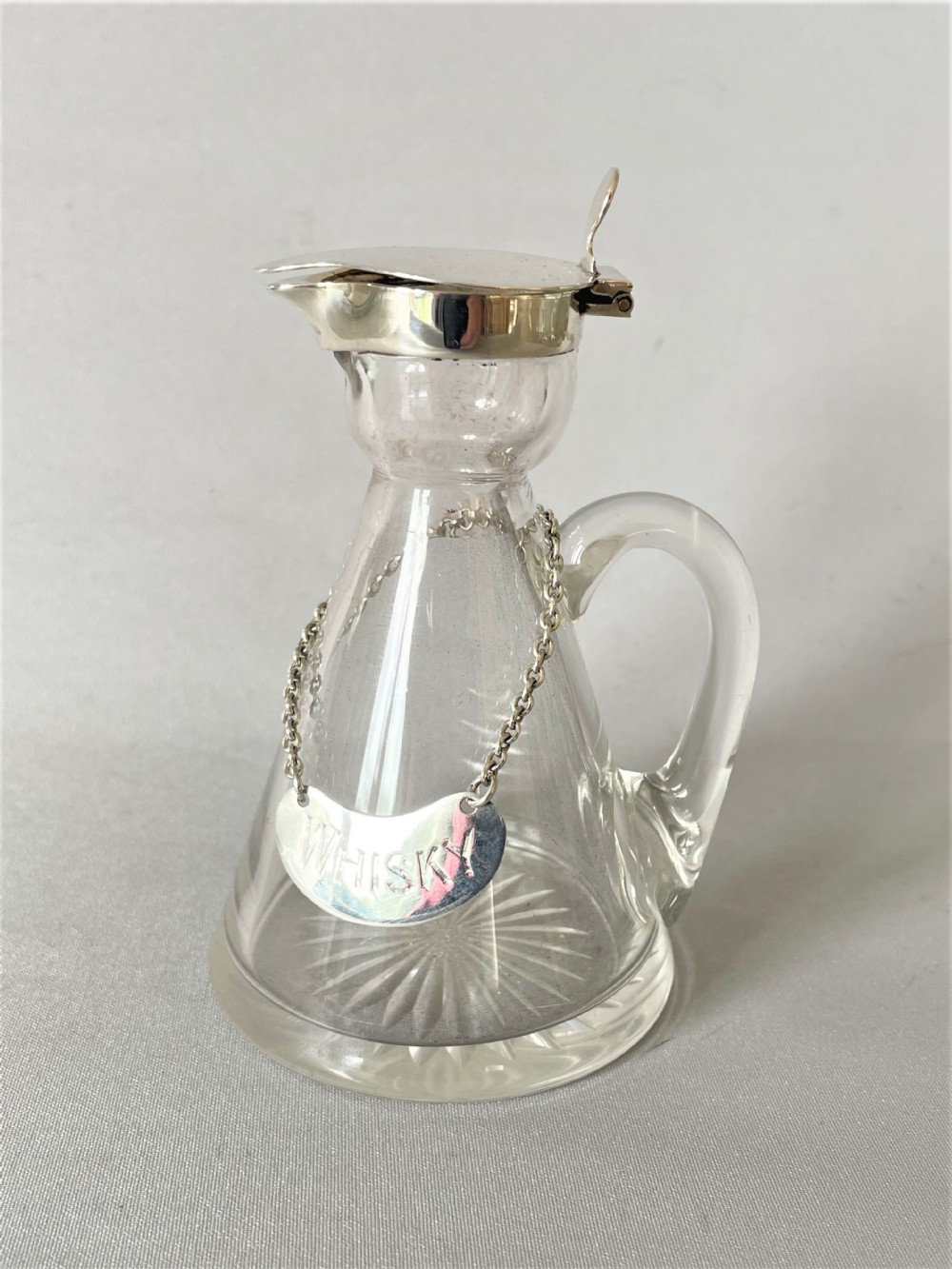 A Hukin & Heath silver mounted Whisky tot/chotopeg