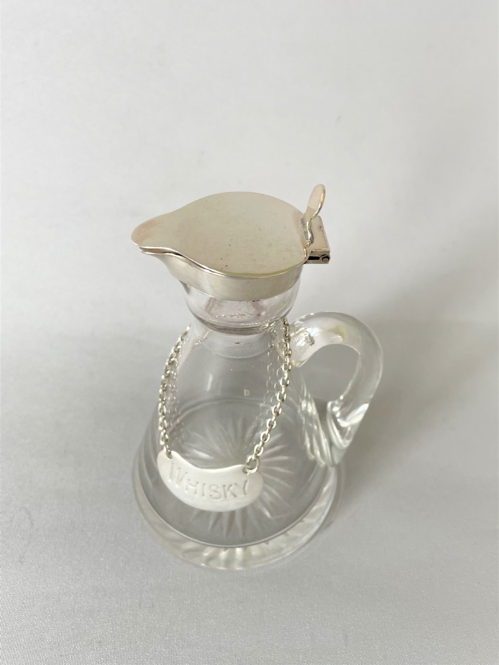 A Hukin & Heath silver mounted Whisky tot/chotopeg View II