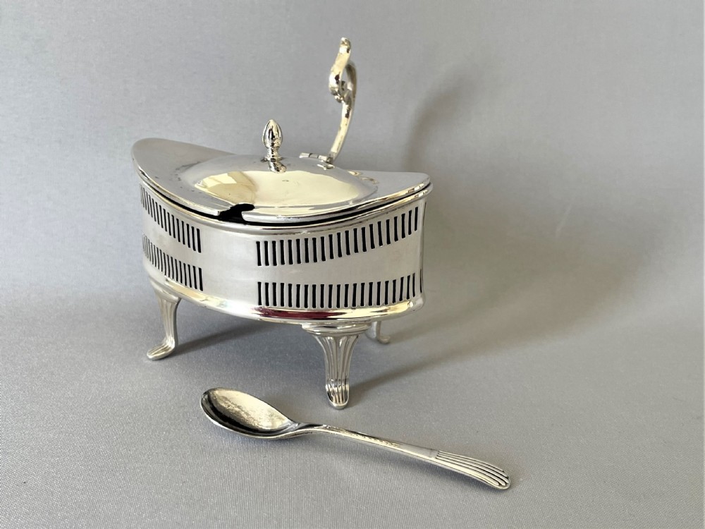 An unusual George V silver mustard pot & spoon