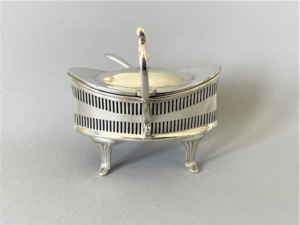 An unusual George V silver mustard pot & spoon View V