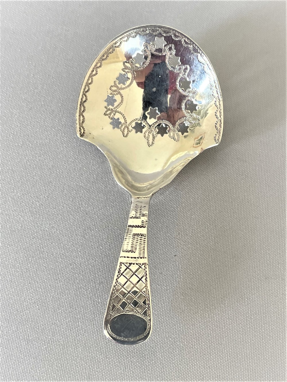 An unusual Georgian pierced silver tea caddy spoon View II