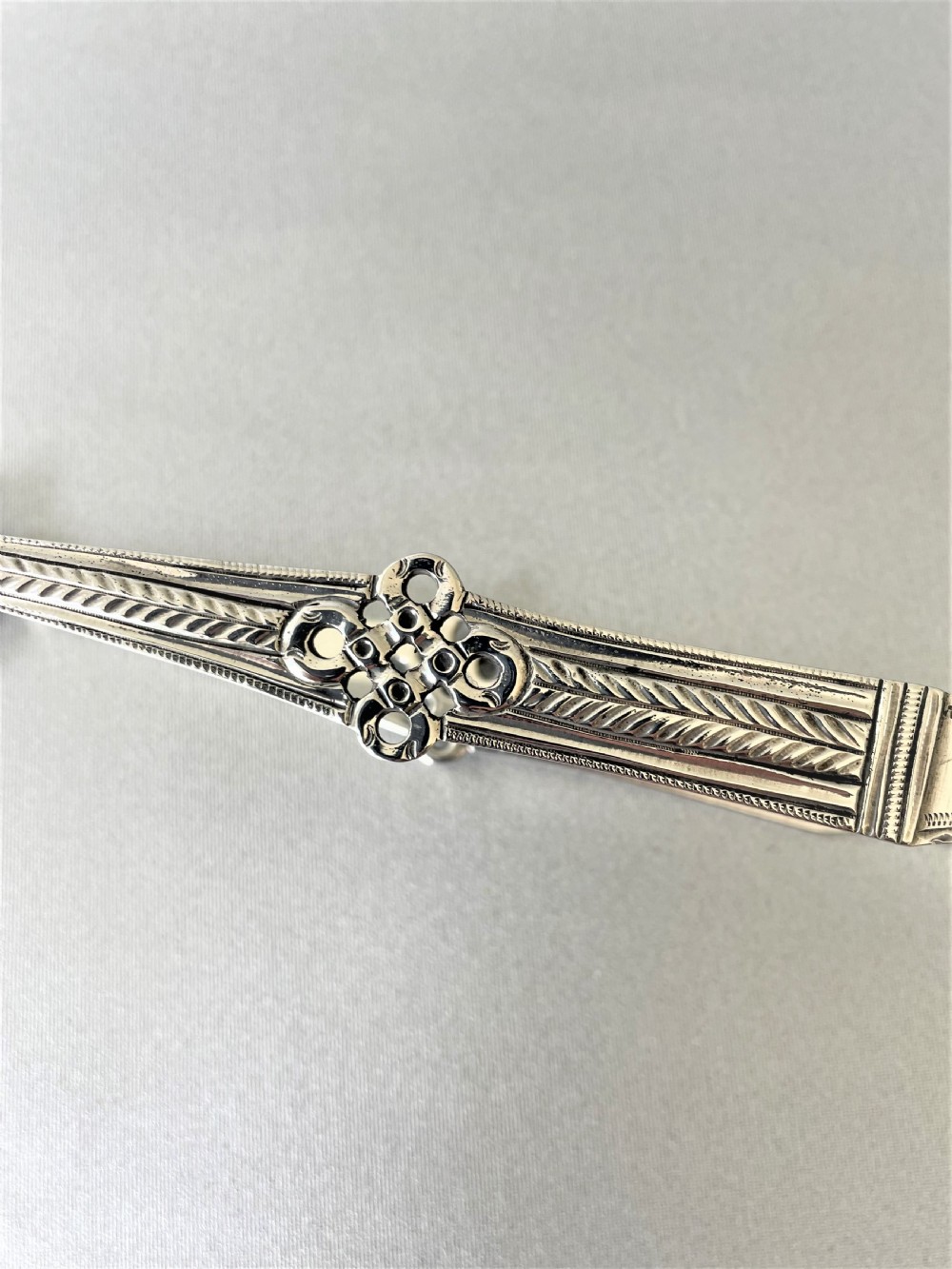 A superb cast pair of 18th Century silver tongs View III