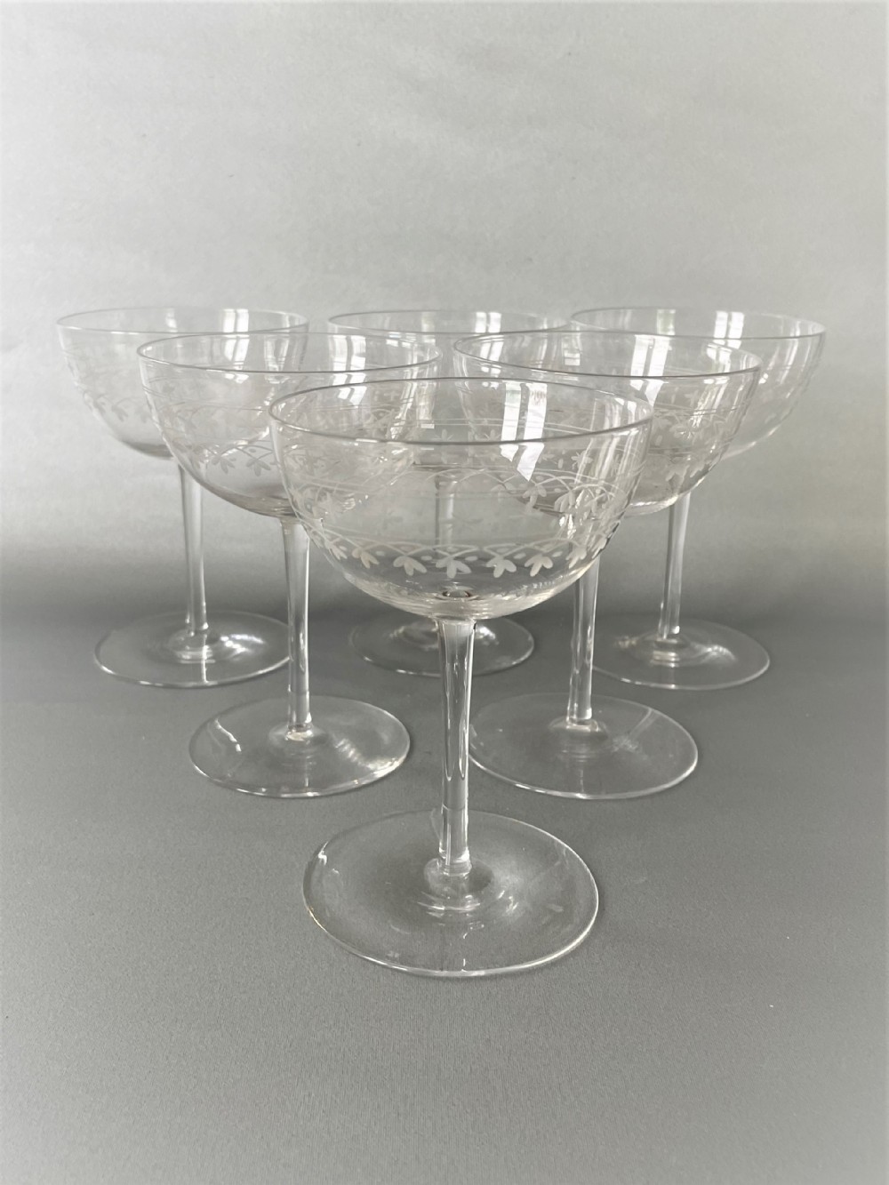 A lovely set of 6 Victorian etched glass champagne coupes